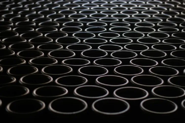 Abstract image featuring circular geometric design, creating a mesmerizing pattern in tones of black and gray.